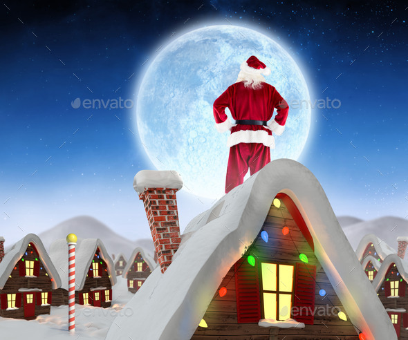 Santa Claus Against Cute Christmas Village In Snow Stock Photo By Wavebreakmedia
