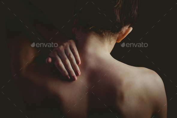 Nude Woman With A Neck Injury On Black Background Stock Photo By