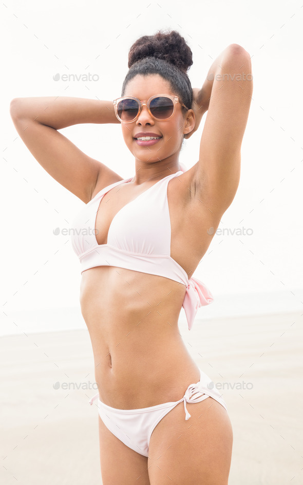 Fit Woman In Bikini Smiling At Camera At The Beach Stock Photo By