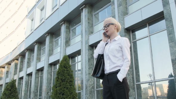 Business Woman Making A Phone Call Outside Business Center Stock Footage