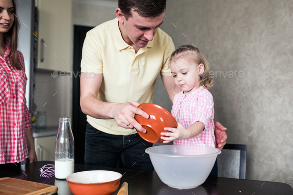 Dad and daughter together in the kitchen Stock Photo by simbiothy | PhotoDune