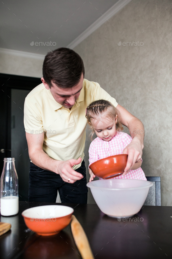 Dad and daughter together in the kitchen Stock Photo by simbiothy | PhotoDune