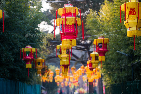 Yellow chinese lantern with messages wishing good luck, health, peace and prosperity Stock Photo by romankosolapov