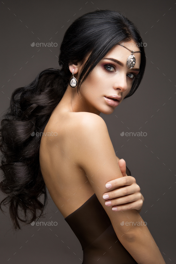 Beautiful Model Brunette With Long Curled Hair Stock Photo By Korabkova