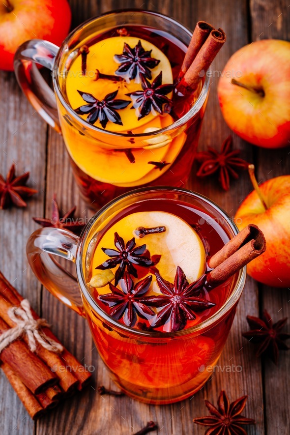 Hot mulled apple cider with cinnamon sticks, cloves and anise Stock