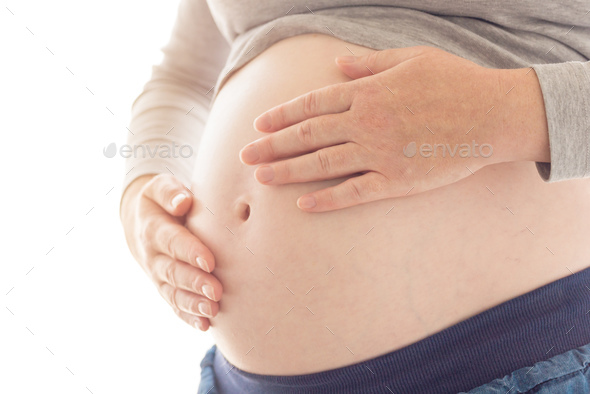 Pregnant Woman Touching And Rubbing Her Belly Stock Photo By Stevanovicigor