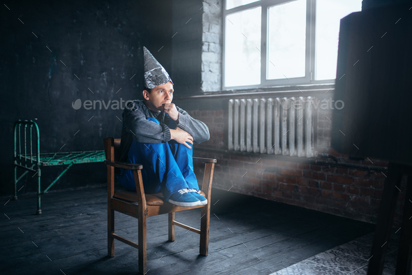 Afraid man in tinfoil helmet watches TV Stock Photo by NomadSoul1 | PhotoDune