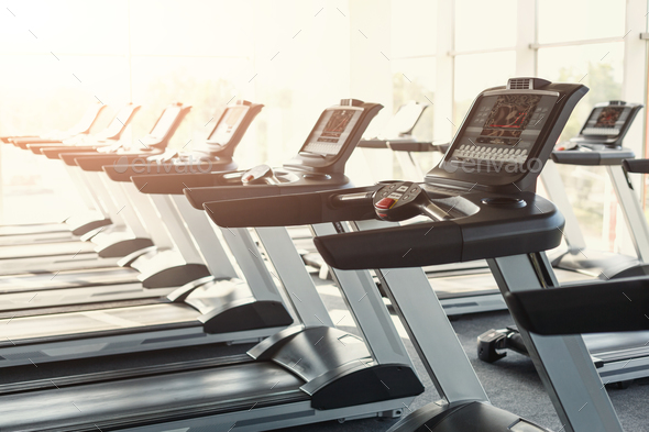 Modern gym interior equipment, treadmill control panels for card Stock Photo by Milkosx