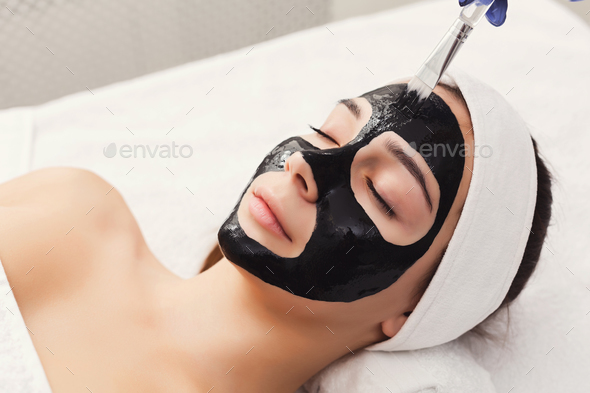 Woman gets face mask by beautician at spa Stock Photo by Milkosx | PhotoDune