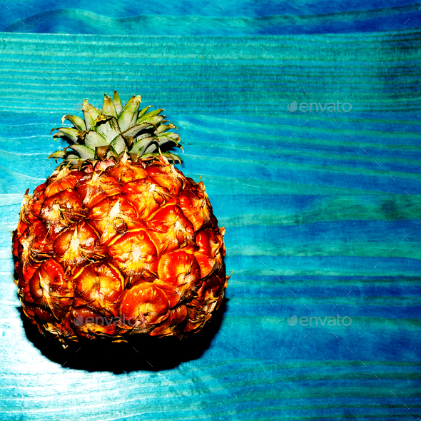 Mini Pineapple on a blue background. Minimal. I love fruit. Fres Stock Photo by EvgeniyaPorechenskaya