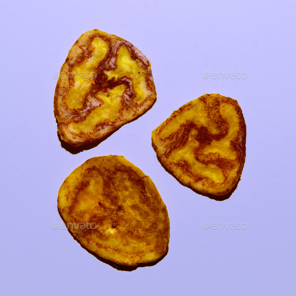 Banana Chips. Vegan fast food Minimal design Stock Photo by EvgeniyaPorechenskaya
