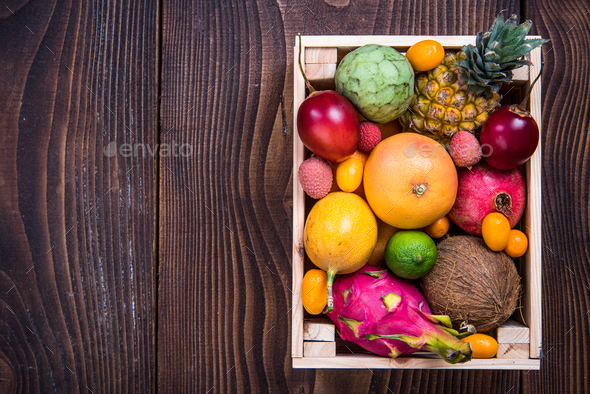 Wooden box with exotic fruits Stock Photo by merc67 | PhotoDune