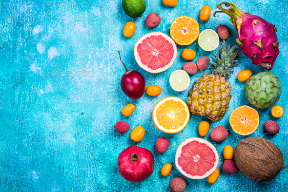Exotic fruits top view border background Stock Photo by merc67 | PhotoDune