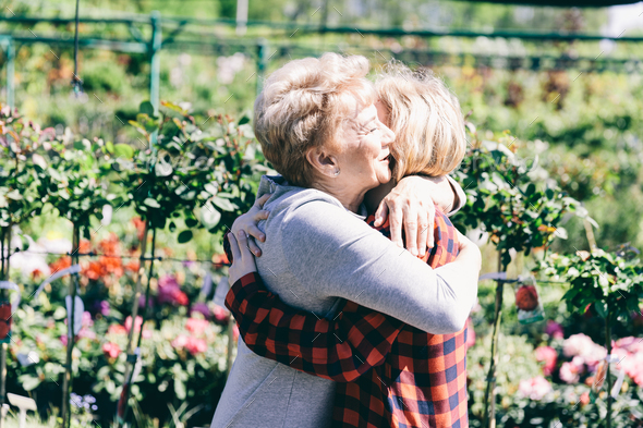 Older lady hugging her granddaughter Stock Photo by photocreo | PhotoDune