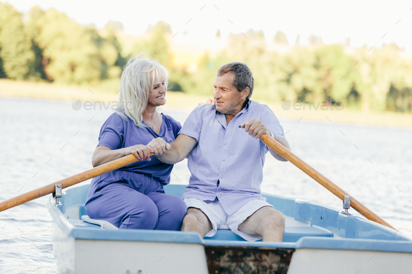 Older couple sailing on a boat. Stock Photo by photocreo | PhotoDune