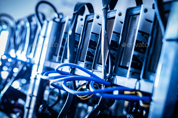 Cryptocurrency mining farm in a close-up shot. Stock Photo by photocreo