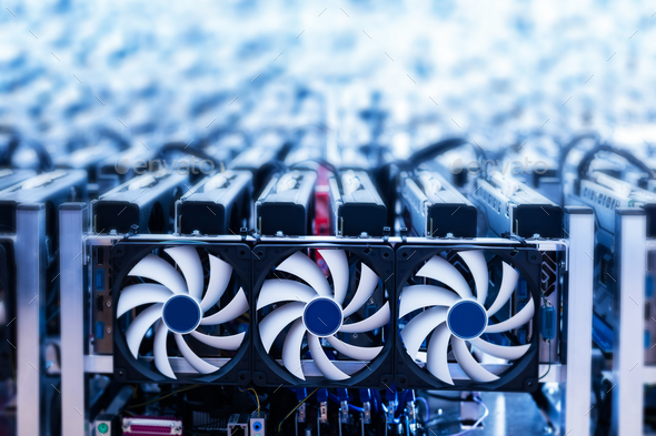 Bitcoin miner. IT device with cooling fans. Stock Photo by photocreo