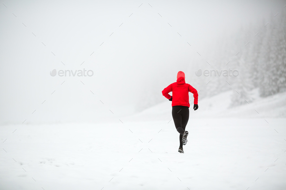 Trail running woman in winter mountains Stock Photo by blas | PhotoDune