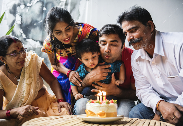 Indian family celebrating a birthday party Stock Photo by Rawpixel
