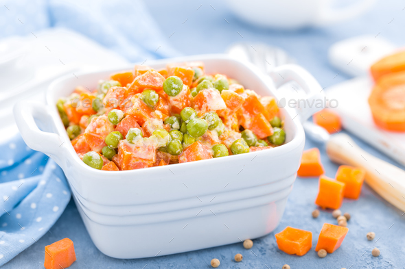 Green peas stewed with carrots in creamy milk white sauce, vegetable stew Stock Photo by sea_wave