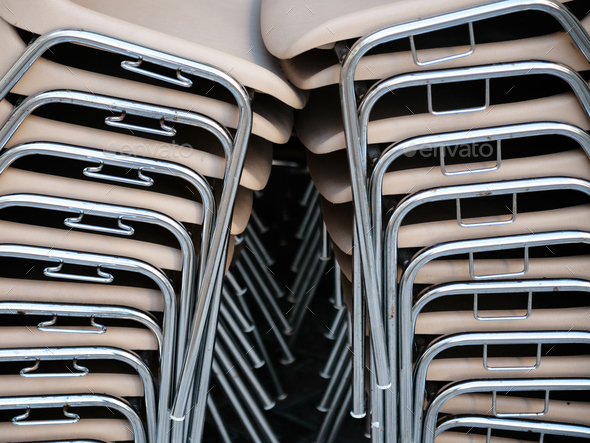 stack of plastic chairs in outdoor cafe Stock Photo by vvoennyy | PhotoDune