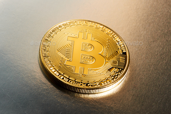 Single Bitcoin cryptocurrency on a gradient Stock Photo by Photology75