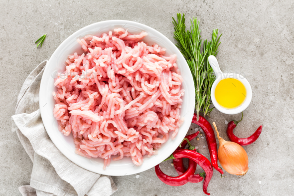 Mince. Ground meat with ingredients for cooking on light grey background. Top view Stock Photo by sea_wave