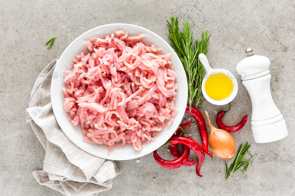 Mince. Ground meat with ingredients for cooking on light grey background. Top view Stock Photo by sea_wave