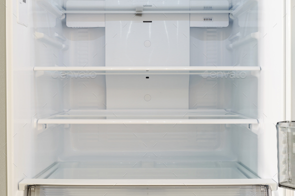 Empty open refrigerator with shelves inside Stock Photo by kitzstocker