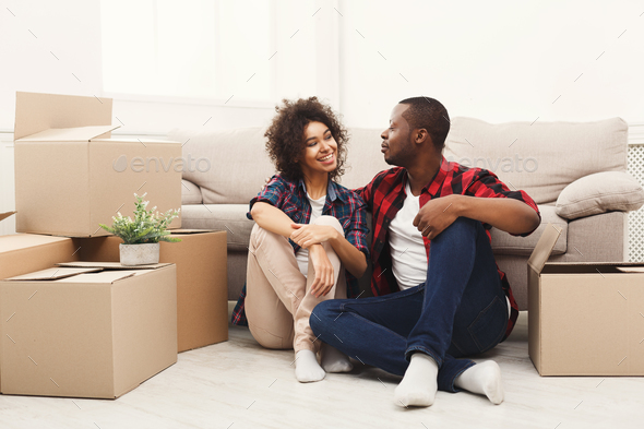 Young balck couple unpacking moving boxes Stock Photo by Milkosx | PhotoDune