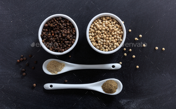 White and black pepper in porcelain bowl and spoon Stock Photo by rawf8