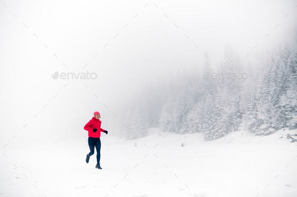 Trail running on snow in winter mountains Stock Photo by blas | PhotoDune