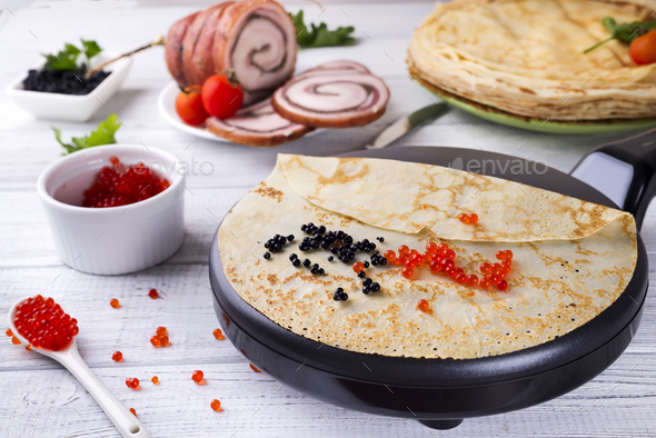 Pancakes with red caviar on plate. Stock Photo by lyulkamazur | PhotoDune
