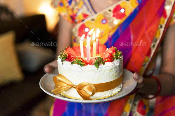 Indian family celebrating a birthday party Stock Photo by Rawpixel