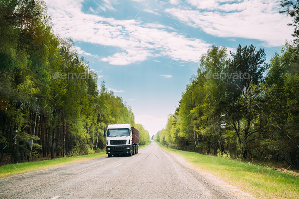 Truck, Tractor Unit, Prime Mover, Traction Unit In Motion On Cou Stock Photo by Grigory_bruev