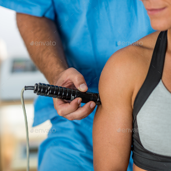 Laser in physical therapy Stock Photo by microgen | PhotoDune
