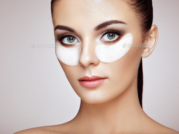 Portrait of Beauty woman with eye patches Stock Photo by heckmannoleg