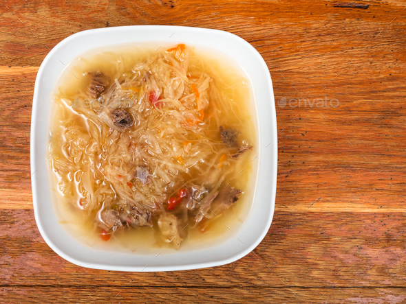 soup with stewed sour cabbage in ceramic plate Stock Photo by vvoennyy