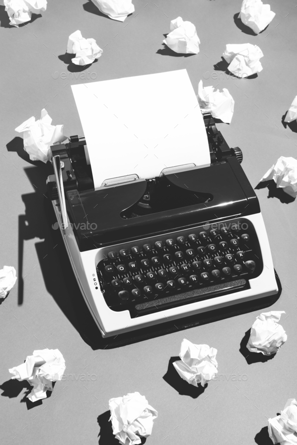 Oldschool typewriter and creased paper. Stock Photo by photocreo | PhotoDune