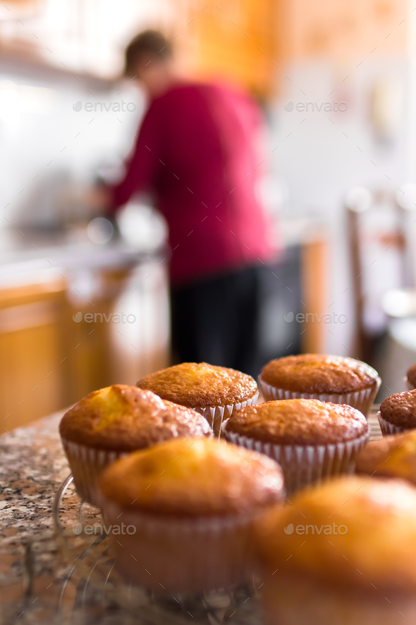 Batch of homemade freshly baked cupcakes or muffins Stock Photo by germanopoli