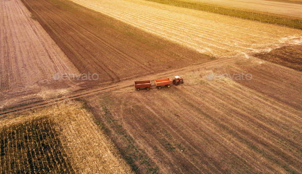 Aerial view of agricultural tractor in the field Stock Photo by stevanovicigor