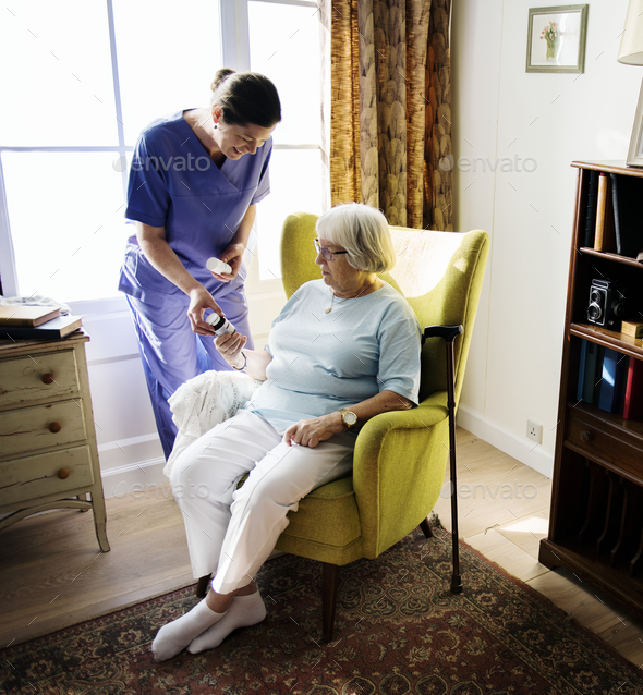 Nurse is taking care of a senior woman Stock Photo by Rawpixel | PhotoDune