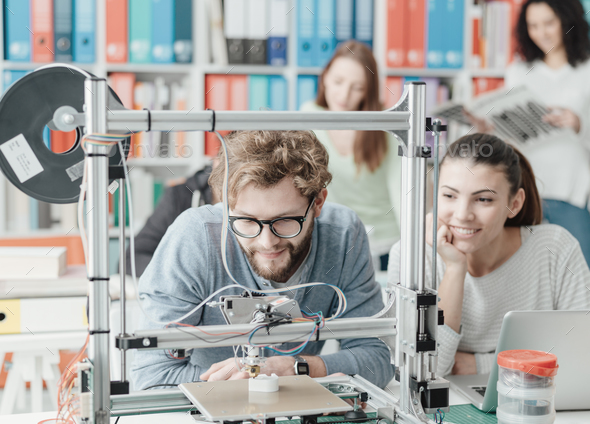 Students using a 3D printer Stock Photo by stokkete | PhotoDune