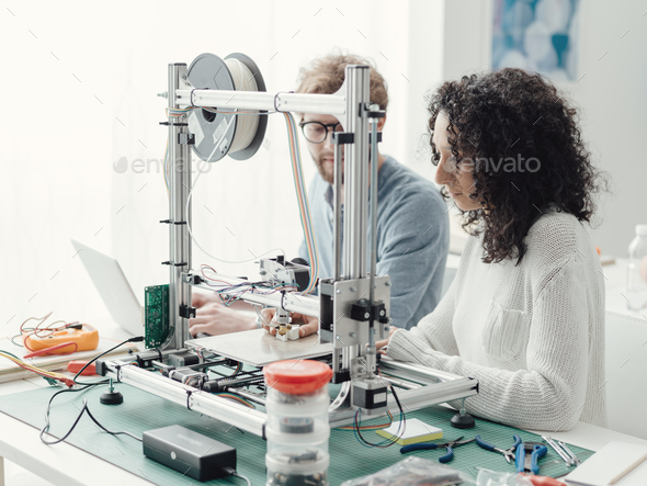 Engineering students using a 3D printer Stock Photo by stokkete | PhotoDune