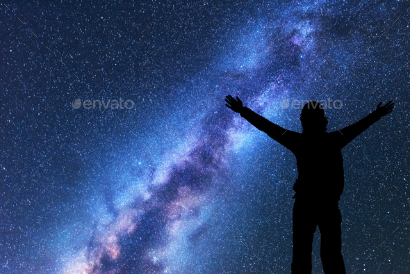 Milky Way. Silhouette of a happy woman. Space Stock Photo by den-belitsky