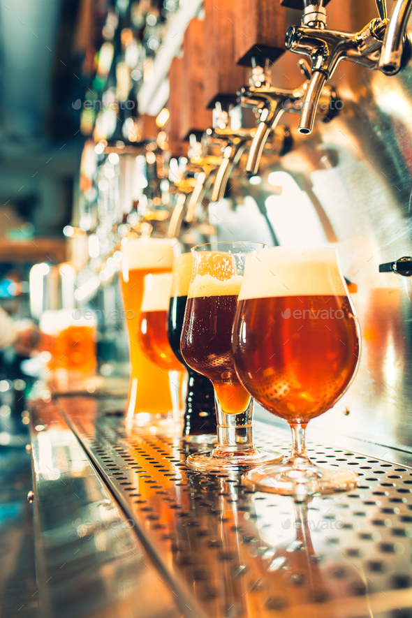 Beer taps in a pub Stock Photo by master1305 | PhotoDune