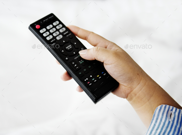 Hand carrying a remote controller Stock Photo by Rawpixel | PhotoDune