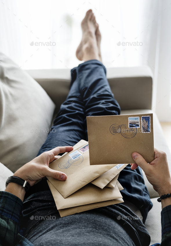 Aerial view of a man sorting an envelope Stock Photo by Rawpixel | PhotoDune