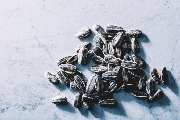 A few black sunflower seeds. Fit snack. Stock Photo by photocreo | PhotoDune