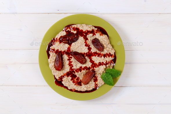 oatmeal porridge with dates Stock Photo by Vikif | PhotoDune